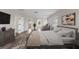 Staged Primary bedroom features hardwood flooring, sitting area, and neutral decor at 634 Canna Dr, Davenport, FL 33897
