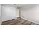 Clean, empty bedroom with wood-look floors and spacious closet for ample storage at 634 Canna Dr, Davenport, FL 33897
