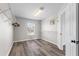 Walk-in closet featuring hardwood flooring, lots of natural light, and wire shelving at 634 Canna Dr, Davenport, FL 33897