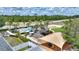 Aerial view showcasing the community pool, playground, picnic area, and lush surroundings at 634 Canna Dr, Davenport, FL 33897