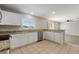 Well-lit kitchen featuring granite countertops, stainless steel appliances and backyard view at 634 Canna Dr, Davenport, FL 33897