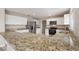 Bright kitchen with stainless steel appliances, granite countertops, and ample storage at 634 Canna Dr, Davenport, FL 33897