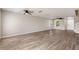 Well-lit living room featuring wood-look floors and recessed lighting at 634 Canna Dr, Davenport, FL 33897