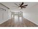 Spacious living room with hardwood floors, natural light, and access to dining area at 634 Canna Dr, Davenport, FL 33897