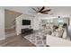 Inviting living room featuring hardwood floors, large windows, and neutral tones at 634 Canna Dr, Davenport, FL 33897