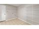 Utility pantry with white wire shelving, tile floors, and washer/dryer hookups at 634 Canna Dr, Davenport, FL 33897
