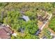 Home surrounded by lush trees and landscaping at 130 Stag Ridge Ct, Longwood, FL 32779