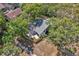 Aerial view of a home surrounded by lush trees and landscaping at 130 Stag Ridge Ct, Longwood, FL 32779