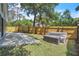 Landscaped backyard with a patio, grass, and privacy fence at 130 Stag Ridge Ct, Longwood, FL 32779