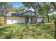 Backyard showing the home's exterior, neat landscaping, trees, and outdoor space, perfect for relaxing or entertaining at 130 Stag Ridge Ct, Longwood, FL 32779