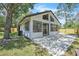 Charming home with a large patio and lush green grass at 130 Stag Ridge Ct, Longwood, FL 32779