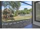 Spacious backyard with a well-maintained lawn, privacy fence, and mature trees viewed from a patio at 130 Stag Ridge Ct, Longwood, FL 32779