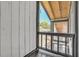 A black railed balcony gives an outdoor view of the yard at 130 Stag Ridge Ct, Longwood, FL 32779