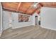 Spacious bedroom featuring wood-look floors, large window and access to bathroom at 130 Stag Ridge Ct, Longwood, FL 32779