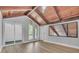Light-filled bedroom boasts vaulted wood ceilings and access to outdoor spaces at 130 Stag Ridge Ct, Longwood, FL 32779