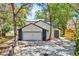 Charming home featuring an attached two car garage, mature trees and easy to maintain landscaping at 130 Stag Ridge Ct, Longwood, FL 32779