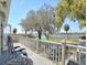 Charming balcony showcasing scenic views, white railings, and outdoor seating; a perfect relaxation spot at 201 Lake Bonny E Dr, Lakeland, FL 33801