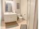 Neat bathroom featuring a shower, toilet, and vanity with a large mirror at 201 Lake Bonny E Dr, Lakeland, FL 33801