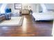 Spacious bedroom featuring hardwood floors, a sitting area, and tasteful décor at 201 Lake Bonny E Dr, Lakeland, FL 33801