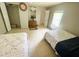 Bright bedroom with two beds, closet and overhead lighting at 201 Lake Bonny E Dr, Lakeland, FL 33801