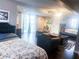 Spacious bedroom with sitting area, natural light, and serene lake view at 201 Lake Bonny E Dr, Lakeland, FL 33801