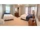 Bedroom featuring two beds, closet, and a dresser with décor at 201 Lake Bonny E Dr, Lakeland, FL 33801