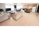 Open-concept living room featuring a kitchen, dining area, and comfortable lounge space with tile flooring at 201 Lake Bonny E Dr, Lakeland, FL 33801