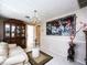 Cozy living room featuring elegant china cabinet, decorative painting, and comfortable seating arrangement at 201 Lake Bonny E Dr, Lakeland, FL 33801