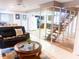 Open living room boasts a staircase feature, comfortable seating, and modern décor at 201 Lake Bonny E Dr, Lakeland, FL 33801