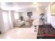 Spacious living room with tile floors, comfortable seating, and ample natural light at 201 Lake Bonny E Dr, Lakeland, FL 33801