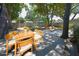 Spacious backyard features a patio, outdoor dining area, and mature trees at 3632 Mockingbird Ln, Orlando, FL 32803