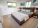 Modern bedroom features a unique headboard, minimalist decor, and natural light at 3632 Mockingbird Ln, Orlando, FL 32803