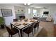 Open-concept dining room boasts marble table, fireplace, and abundant natural light at 3632 Mockingbird Ln, Orlando, FL 32803