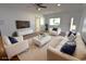 Bright living room features modern decor, white furniture, and hardwood floors at 3632 Mockingbird Ln, Orlando, FL 32803