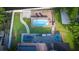 An aerial shot features an inviting pool with sun deck, patio seating, and a lush green lawn at 1315 Olympia Park Cir, Ocoee, FL 34761
