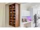Modern bar area featuring custom shelving and recessed lighting at 1315 Olympia Park Cir, Ocoee, FL 34761
