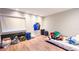 Spacious basement with light-wood floors, and a window with black sound proofing on the wall at 1315 Olympia Park Cir, Ocoee, FL 34761