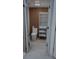 Modern bathroom featuring toilet, shelves, wooden wall and tile flooring at 1315 Olympia Park Cir, Ocoee, FL 34761