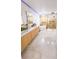 Modern bathroom featuring double vanity, soaking tub, glass enclosed shower, and beautiful marble flooring at 1315 Olympia Park Cir, Ocoee, FL 34761