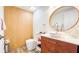 Stylish bathroom featuring wood accent wall, vessel sink, and modern fixtures at 1315 Olympia Park Cir, Ocoee, FL 34761