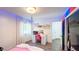 Bright bedroom featuring an office desk, swing and led lighting accents at 1315 Olympia Park Cir, Ocoee, FL 34761