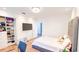 Bedroom featuring white walls, mounted TV and closet with shelves at 1315 Olympia Park Cir, Ocoee, FL 34761