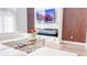 Modern living room with electric fireplace, large TV, and comfortable seating at 1315 Olympia Park Cir, Ocoee, FL 34761