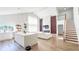 Living space featuring kitchen island, living room with fireplace, and stairway at 1315 Olympia Park Cir, Ocoee, FL 34761