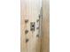 Modern shower details featuring shower heads and handles with a vertically ridged wall at 1315 Olympia Park Cir, Ocoee, FL 34761