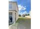 Spacious backyard with a grill and some lawn at 10601 Burlwood Dr, Leesburg, FL 34788