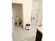 Bright bathroom featuring a toilet and a shower with glass door at 10601 Burlwood Dr, Leesburg, FL 34788