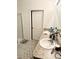 Bathroom showcasing a double vanity, framed mirror, and shower with a glass door at 10601 Burlwood Dr, Leesburg, FL 34788