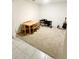 Multi-purpose bonus room with a table, chairs, piano and guitar at 10601 Burlwood Dr, Leesburg, FL 34788