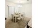Bright dining area with natural light and seating for six at 10601 Burlwood Dr, Leesburg, FL 34788